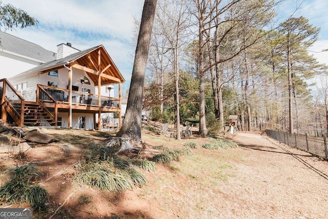 view of yard with a wooden deck