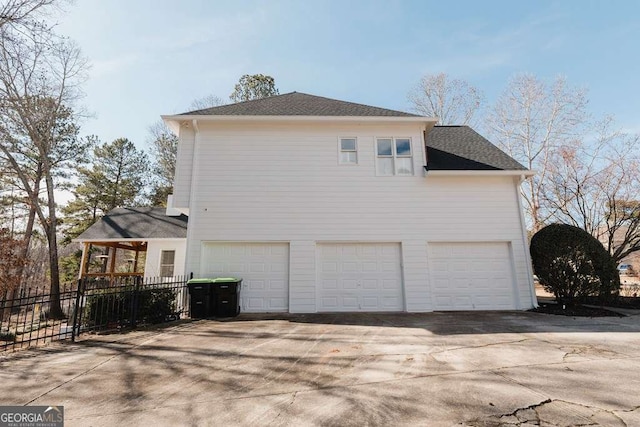 view of side of home with a garage