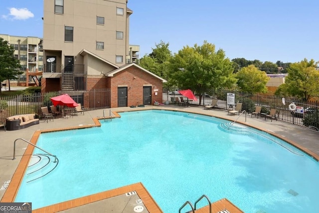 view of pool featuring a patio area