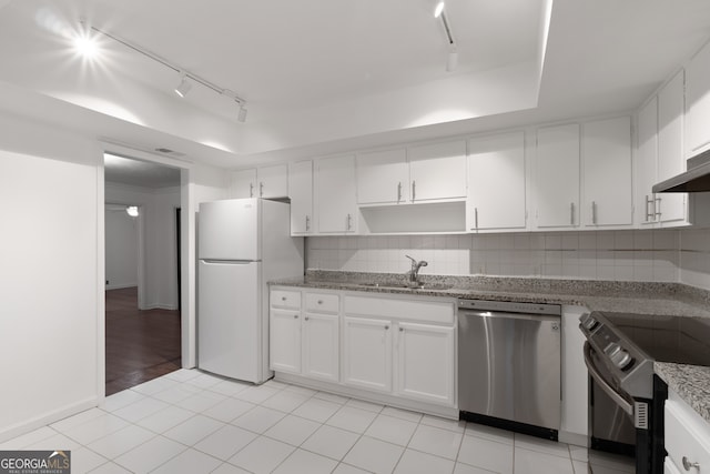 kitchen featuring sink, range with electric stovetop, stainless steel dishwasher, white fridge, and white cabinets