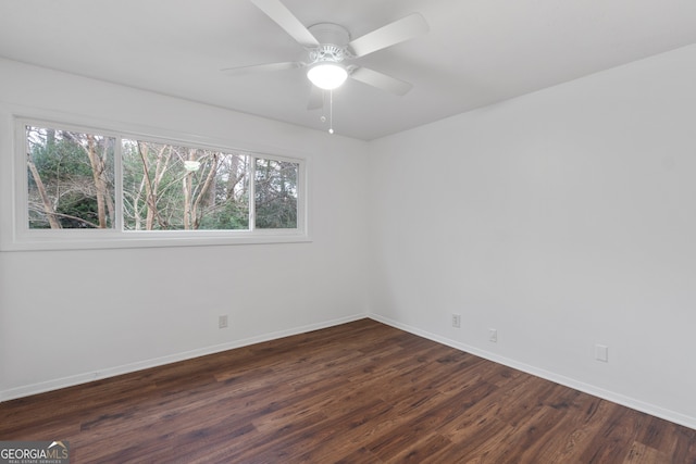 empty room featuring dark hardwood / wood-style floors and ceiling fan