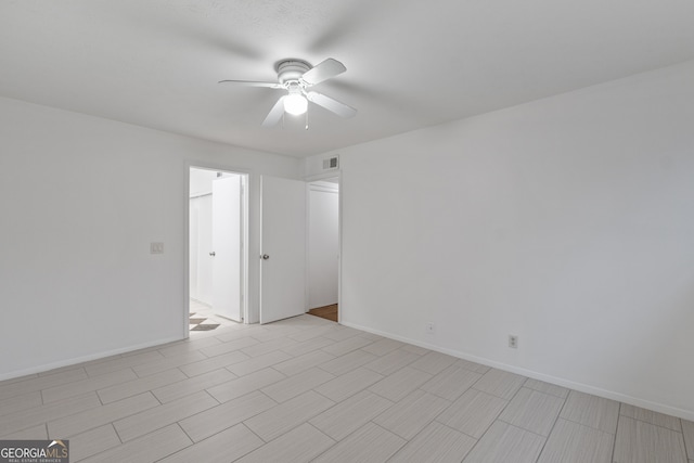 spare room with ceiling fan