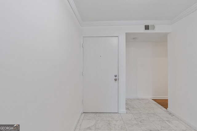 unfurnished room featuring ornamental molding and hardwood / wood-style floors