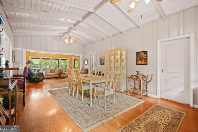 dining area with lofted ceiling, hardwood / wood-style floors, and ceiling fan