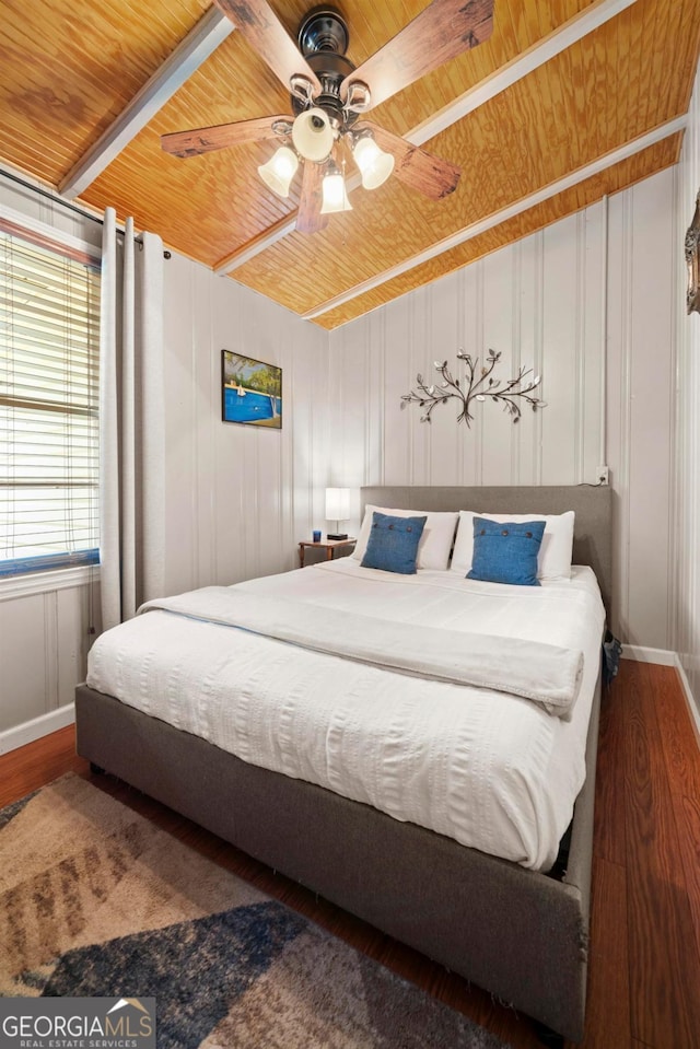 bedroom with ceiling fan, wooden ceiling, and dark hardwood / wood-style flooring