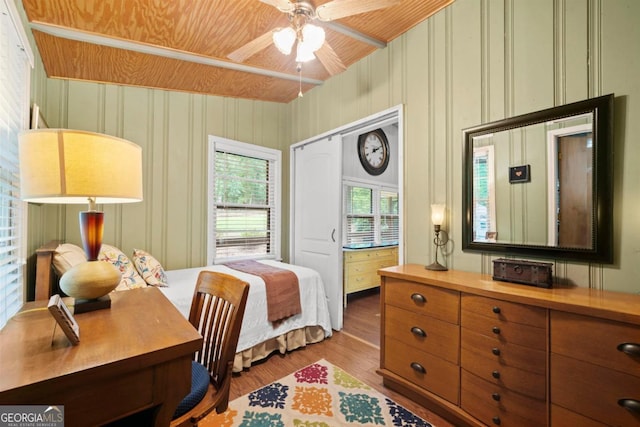 bedroom with wood-type flooring and ceiling fan