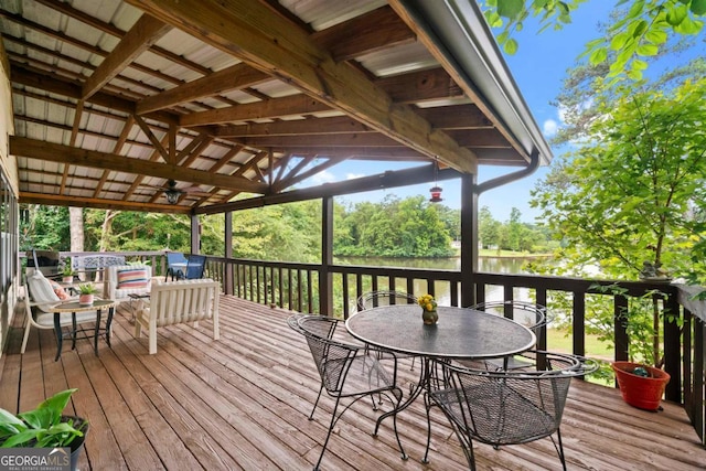 wooden deck with a water view