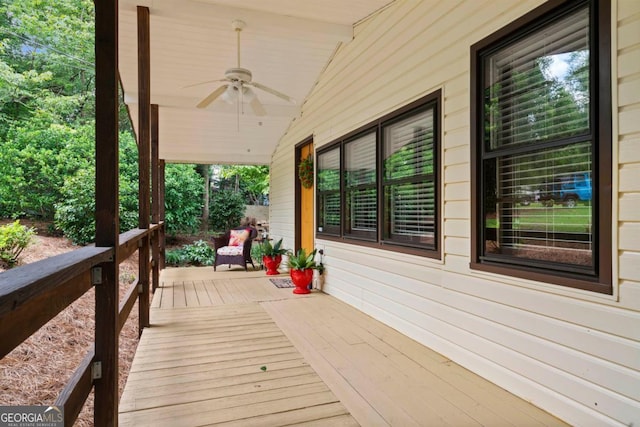 wooden terrace with ceiling fan