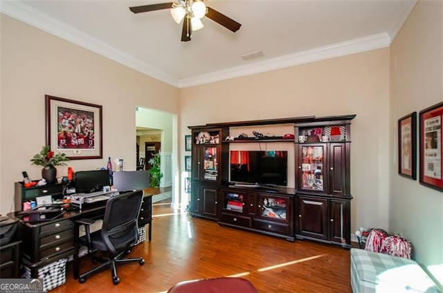 home office with hardwood / wood-style flooring, ceiling fan, and crown molding