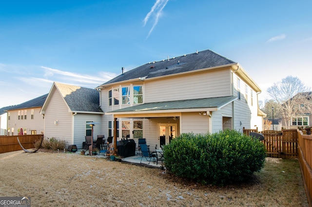 back of house with a patio