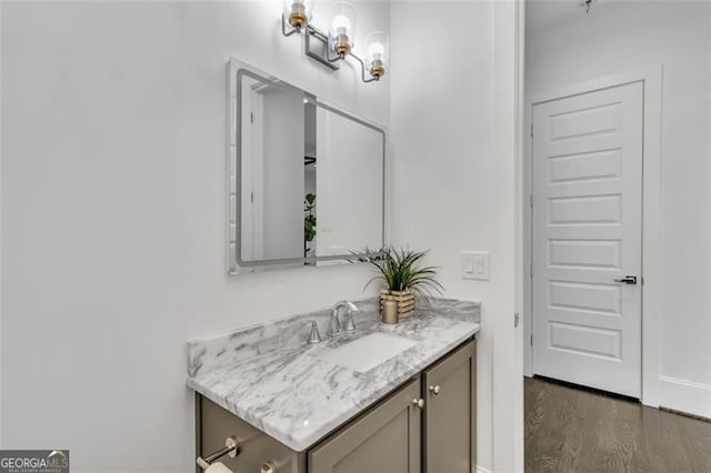 bathroom with vanity and hardwood / wood-style floors