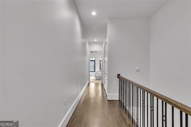 hall with dark hardwood / wood-style flooring