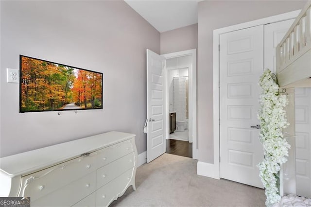 bedroom featuring light carpet