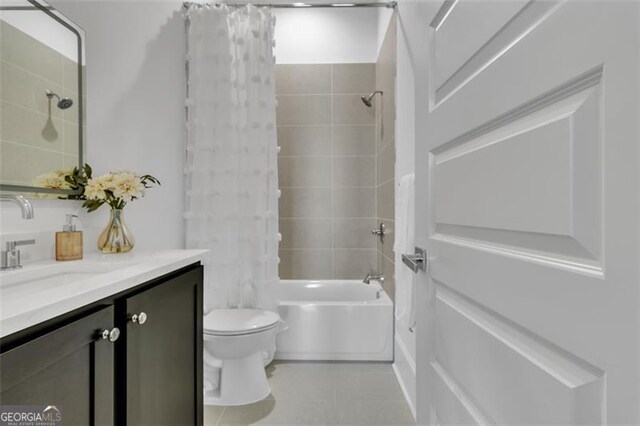 full bathroom with shower / bath combination with curtain, tile patterned floors, toilet, and vanity