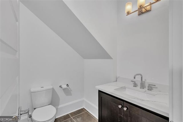 bathroom featuring tile patterned floors, toilet, and vanity