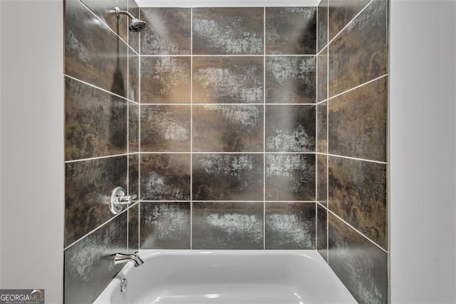 interior details featuring tiled shower / bath