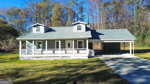 view of front of property with a carport, covered porch, and a front yard