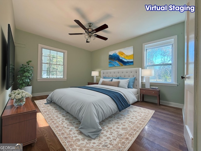 bedroom with ceiling fan and dark hardwood / wood-style flooring