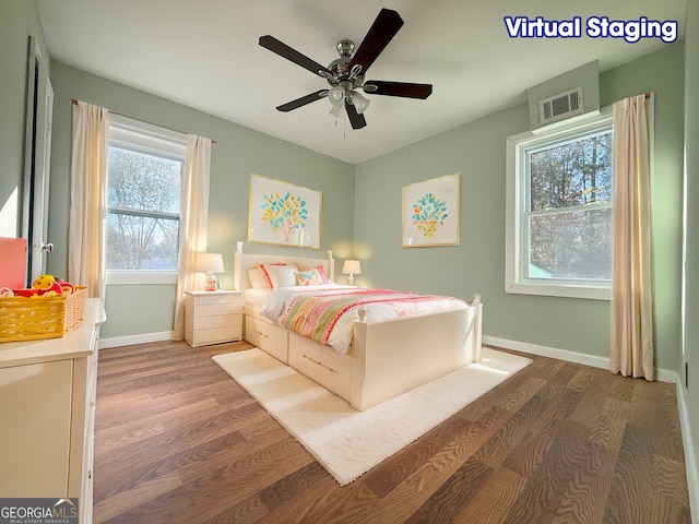 bedroom featuring ceiling fan and dark hardwood / wood-style flooring