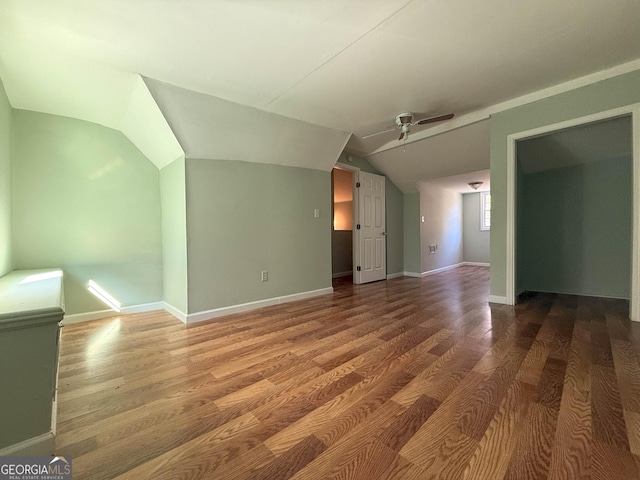 bonus room featuring ceiling fan, wood-type flooring, and vaulted ceiling