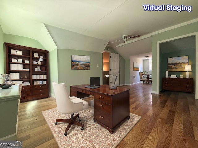 office area with hardwood / wood-style flooring, vaulted ceiling, and ceiling fan