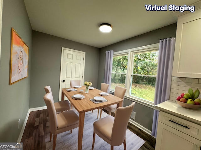 dining area with dark hardwood / wood-style floors