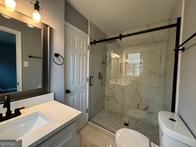 bathroom featuring vanity, toilet, and an enclosed shower