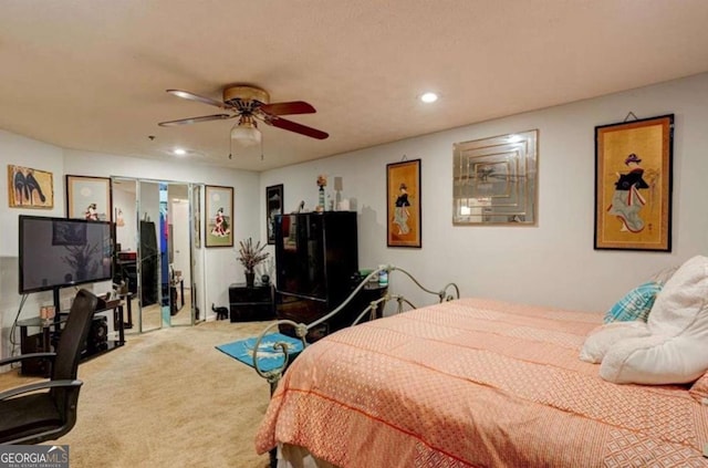 carpeted bedroom featuring ceiling fan