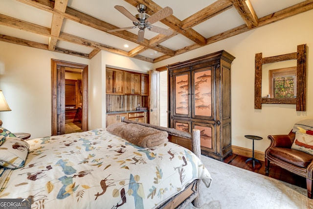 bedroom with coffered ceiling, dark hardwood / wood-style floors, and beamed ceiling