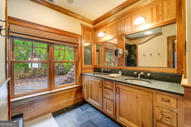 bathroom featuring crown molding and vanity