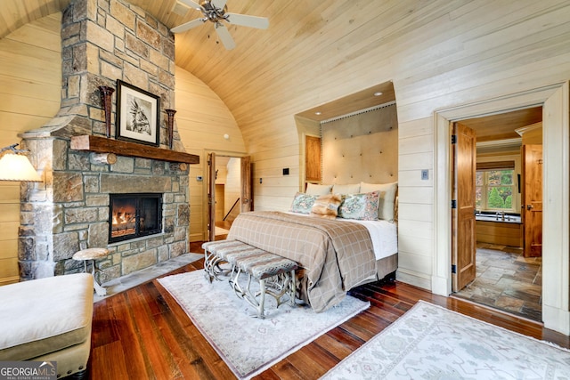 bedroom with lofted ceiling, dark wood-type flooring, wood ceiling, and wooden walls