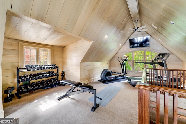 workout area featuring lofted ceiling, wood ceiling, carpet floors, and wooden walls