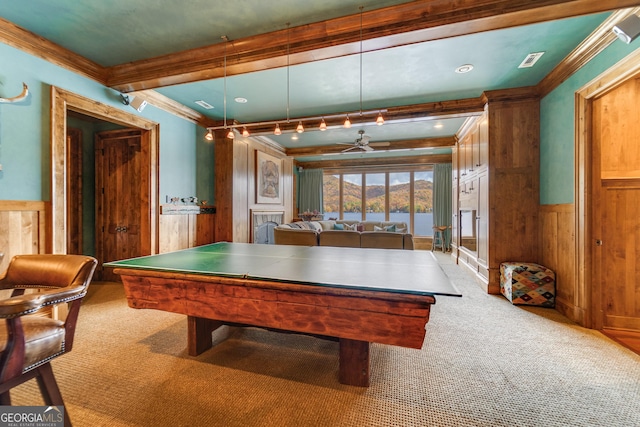 playroom with crown molding, beam ceiling, and carpet