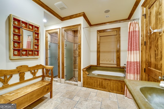 bathroom with independent shower and bath, ornamental molding, and vanity