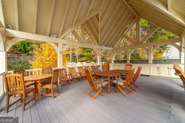 sunroom / solarium with lofted ceiling with beams