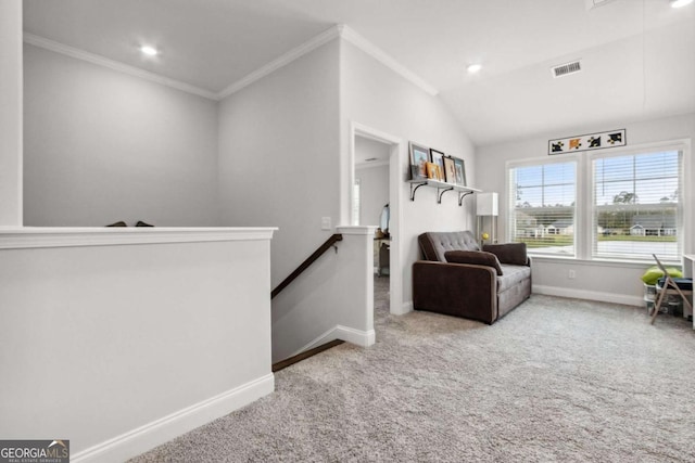 living area featuring lofted ceiling, crown molding, and carpet flooring