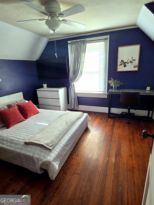 bedroom featuring dark wood-type flooring, ceiling fan, and lofted ceiling