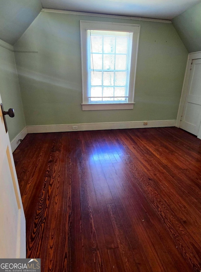 bonus room with wood-type flooring and lofted ceiling