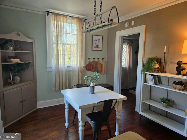 dining area with crown molding and dark hardwood / wood-style floors