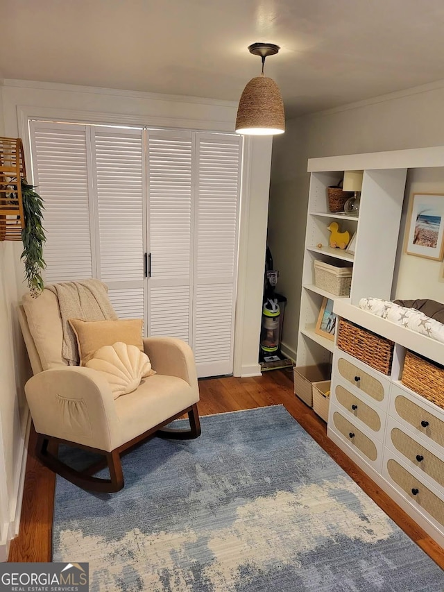 sitting room with dark hardwood / wood-style flooring