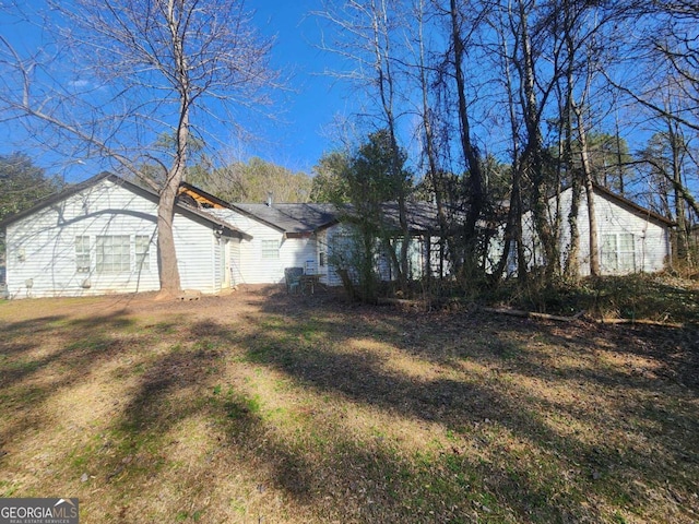 view of property exterior featuring a yard