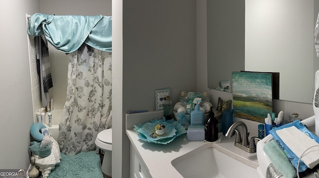 full bathroom featuring shower / bath combination with curtain, vanity, and toilet