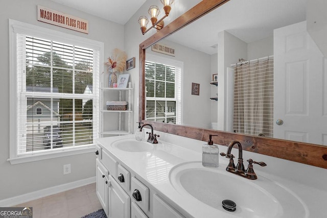 bathroom with tile patterned flooring, vanity, and a shower with curtain