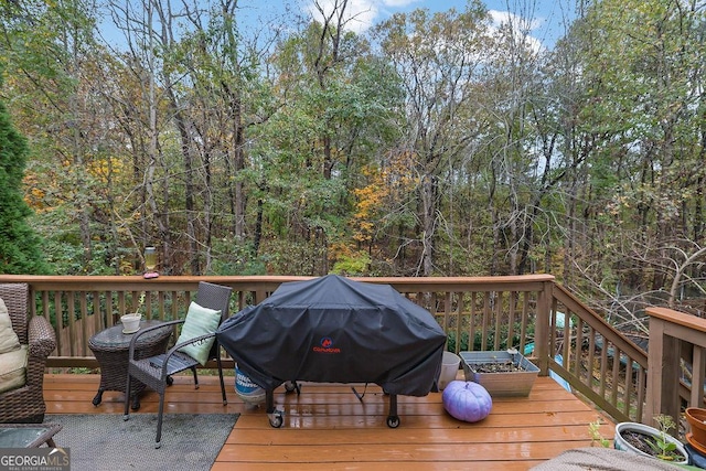 wooden deck with area for grilling