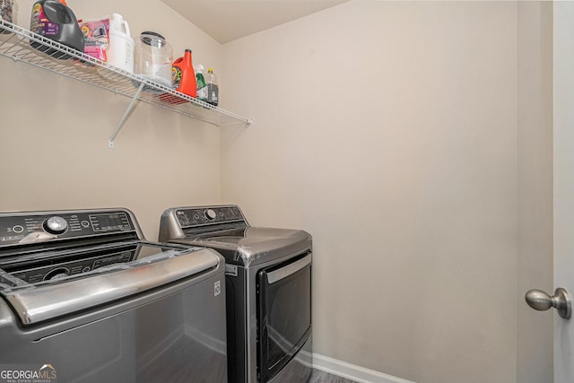 laundry room with independent washer and dryer