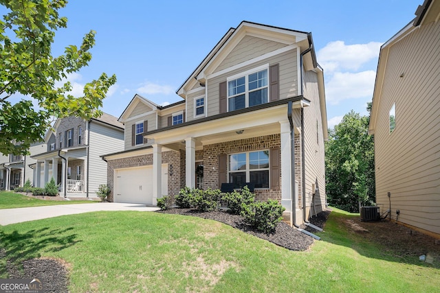 craftsman house with a garage, a front yard, covered porch, and central air condition unit