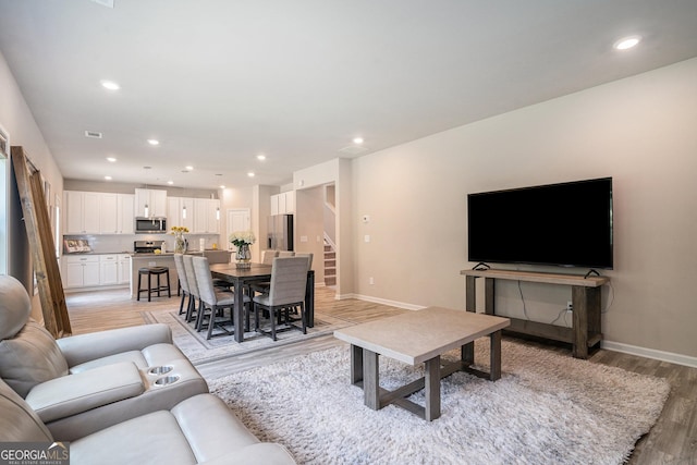 living room with light hardwood / wood-style floors