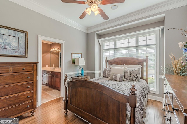 bedroom featuring crown molding, ceiling fan, ensuite bathroom, and light hardwood / wood-style floors