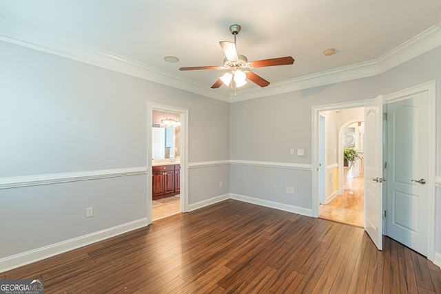 unfurnished bedroom featuring ornamental molding and dark hardwood / wood-style floors