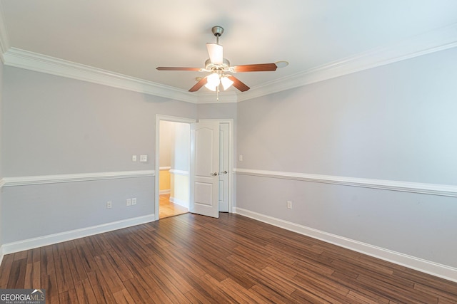 spare room with crown molding, ceiling fan, and dark hardwood / wood-style floors